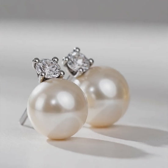 Model wearing Estelle pearl and diamond stud earrings