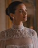 Bride wearing LYS gold pearl cluster earrings