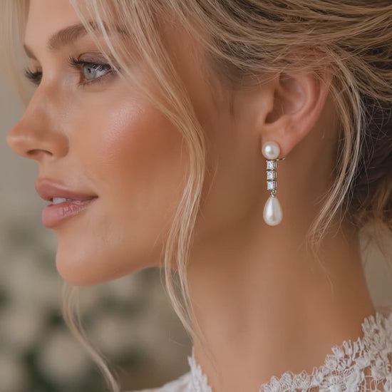 Lunaire pearl drop earrings shown worn, bridal styling