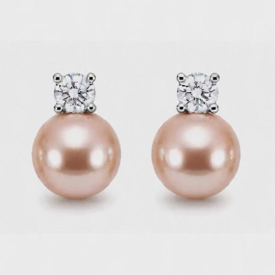 Model wearing Estelle champagne pink pearl stud earrings