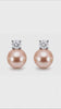 Model wearing Estelle champagne pink pearl stud earrings