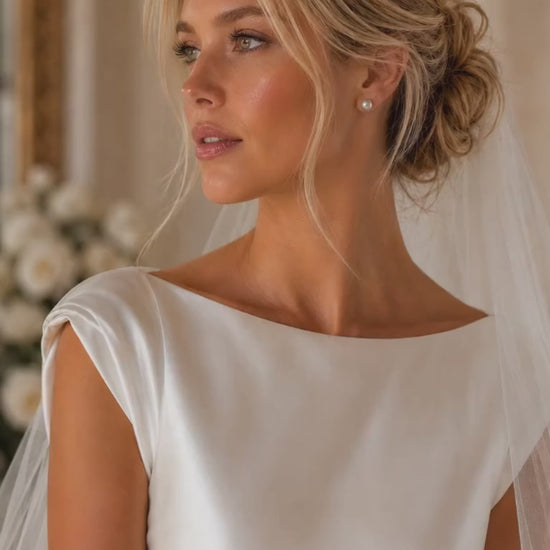 Bride wearing Vivienne pearl stud earrings